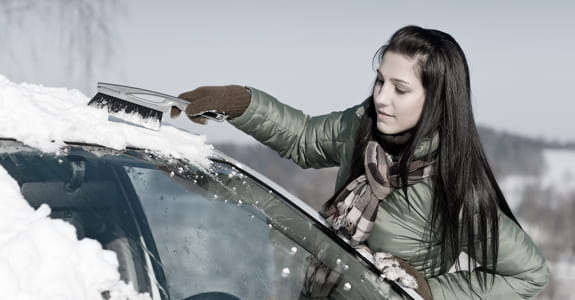 Brushing Snow Off Car