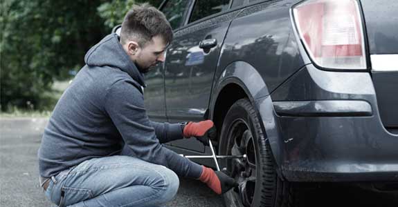 Man Changing Car Tire